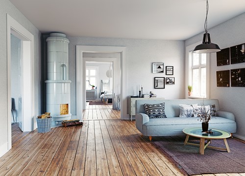 En vardagsum med möbler i skandinavisk stil med trägolv och starkt ljus.