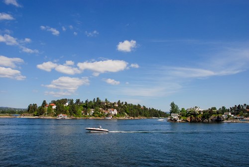 Beautiful scenery with blue skies and a boat from Norway.